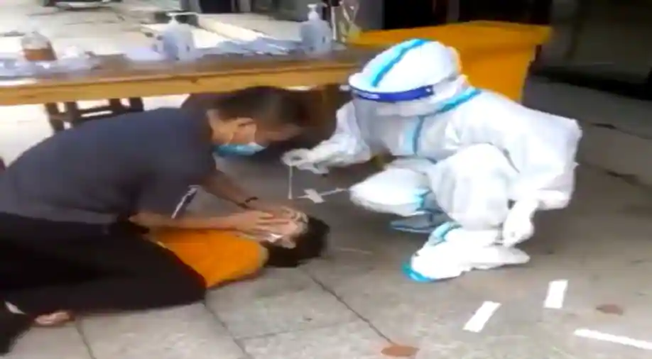 Viral Video: Chinese Woman Pinned Down, Covid Test Done Forcibly